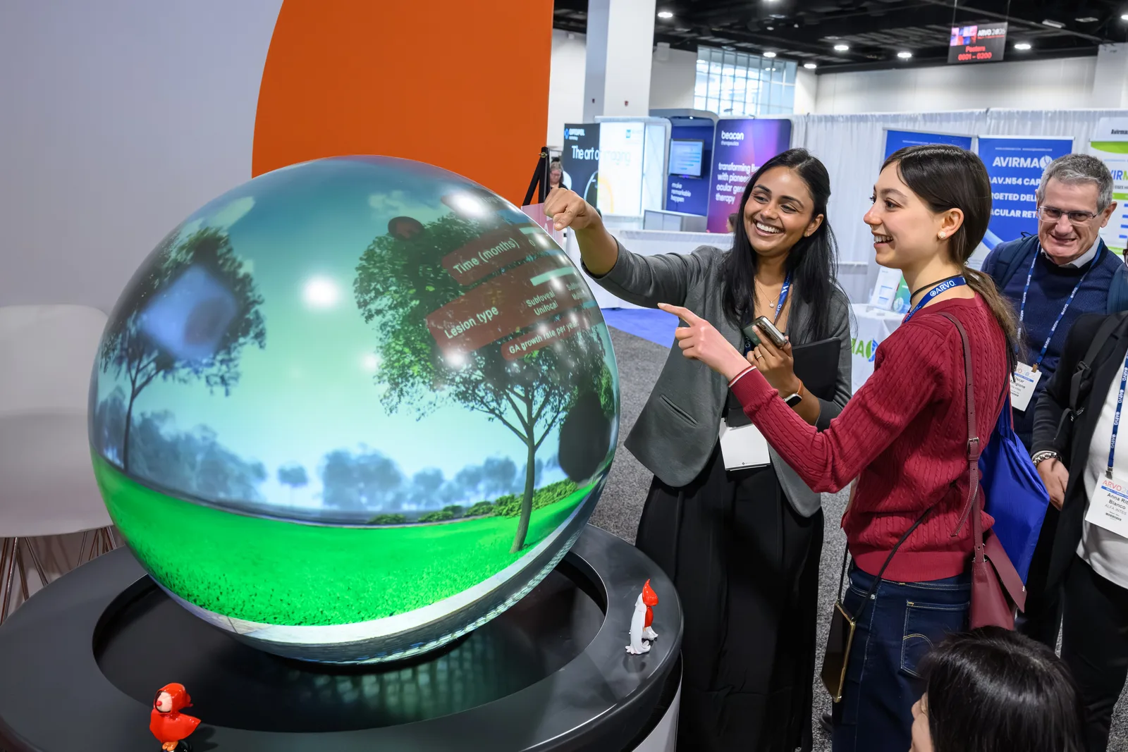 Conference delegates exploring interactive spherical content