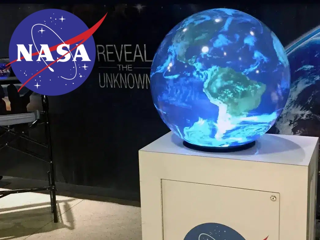 Spherical display presenting planetary content at a NASA exhibition