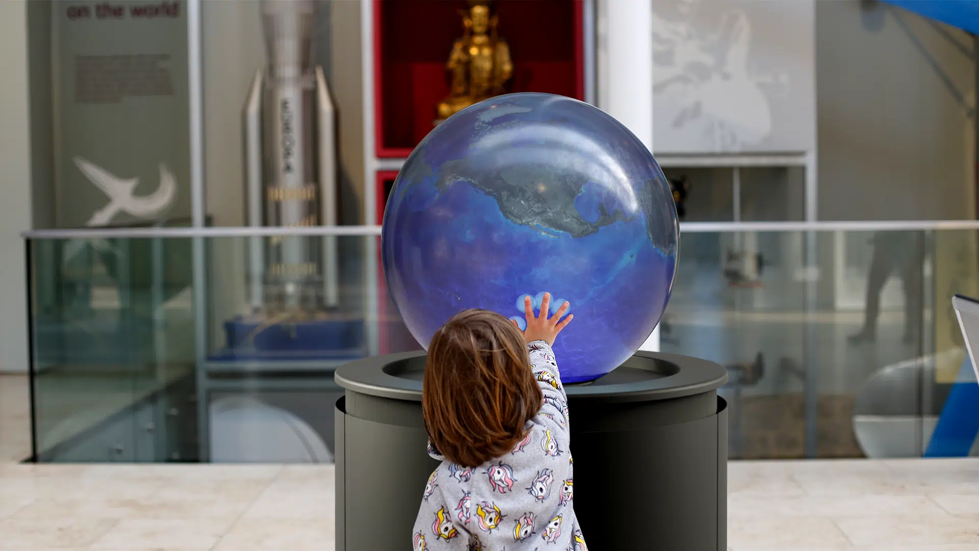 A child is fascinated by the PufferTouch's response at the Edinburgh Science Festival